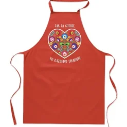 Forklæder>KØKKENFORKLÆDE med PRINT Folklore WHEN COOK ALLONE LIKES IT hjerte